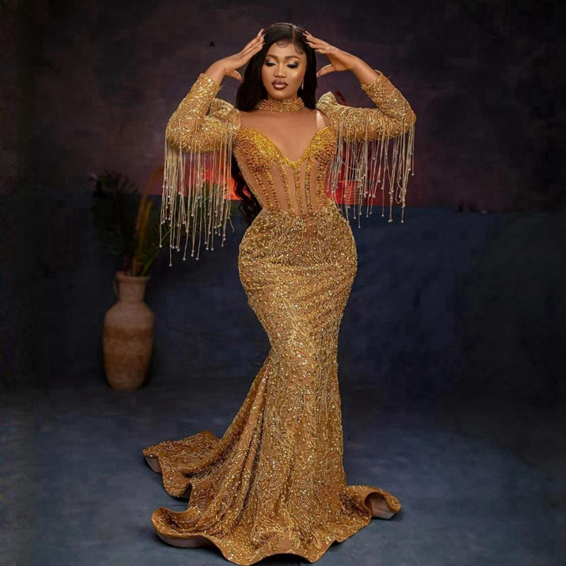 Altın Afrika Arapça Plus Boyut Aso Ebi Prom Elbiseler Yüksek Boyun Uzun Kollu Sapalar Dantel Akşam Resmi Elbise Boncuk Püsküllü Doğum Günü Elbise Nişan Elbisesi NL207