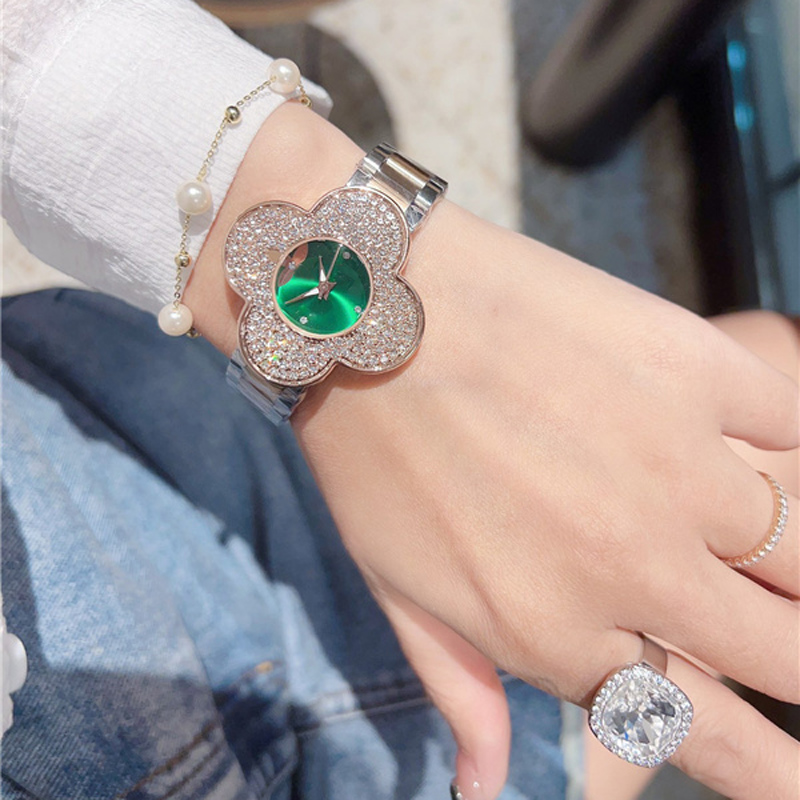 Mode pleine marque montre-bracelet femmes dames fleur Orologio Style luxe avec Logo acier métal bande Quartz horloge L93