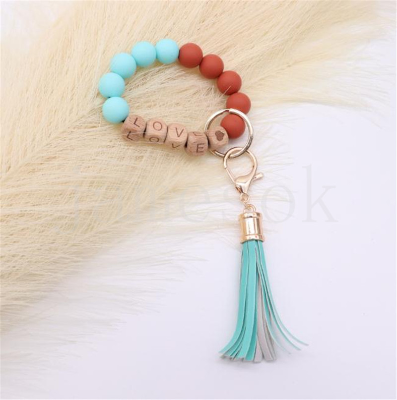 Wholesale food grade silicone beads wrist keychain alloy cap PU leather tassel keychain female multicolor optional DF067