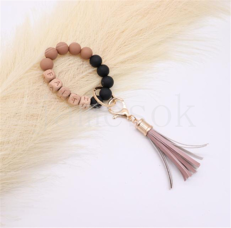 Wholesale food grade silicone beads wrist keychain alloy cap PU leather tassel keychain female multicolor optional DF067