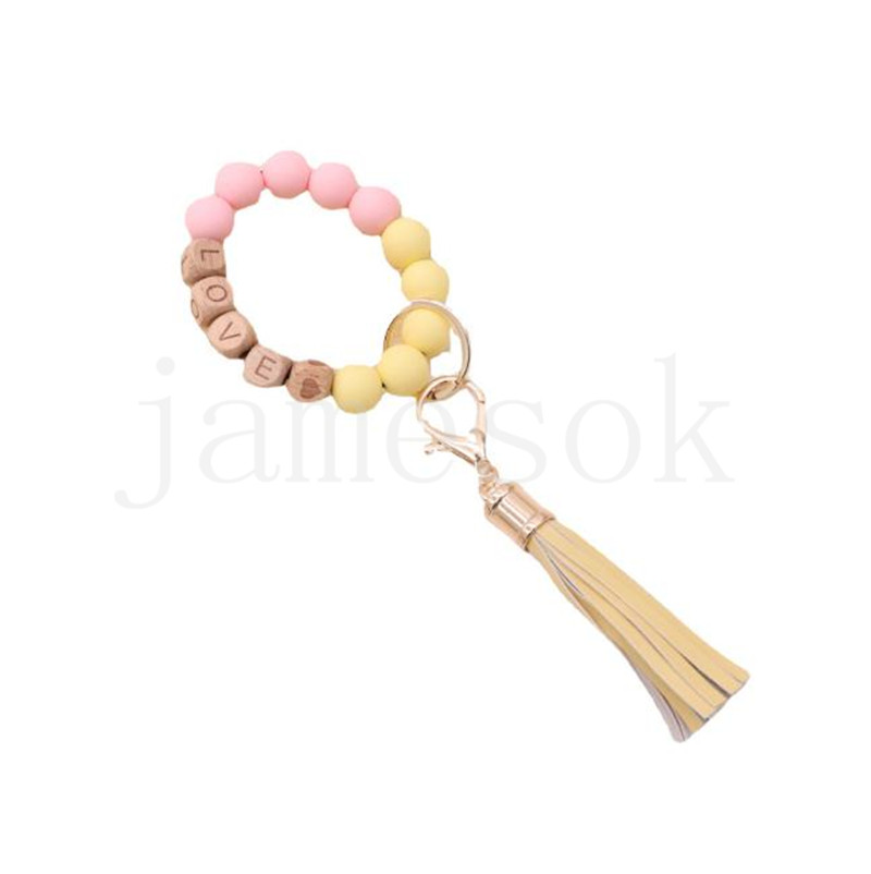 Wholesale food grade silicone beads wrist keychain alloy cap PU leather tassel keychain female multicolor optional DF067