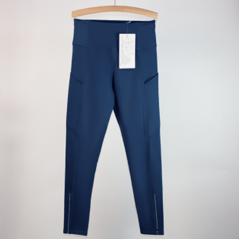 Les pantalons de yoga alignent les leggings multi-poches brossés à double face pour la course de fitness avec des cultures ponctuelles réfléchissantes.