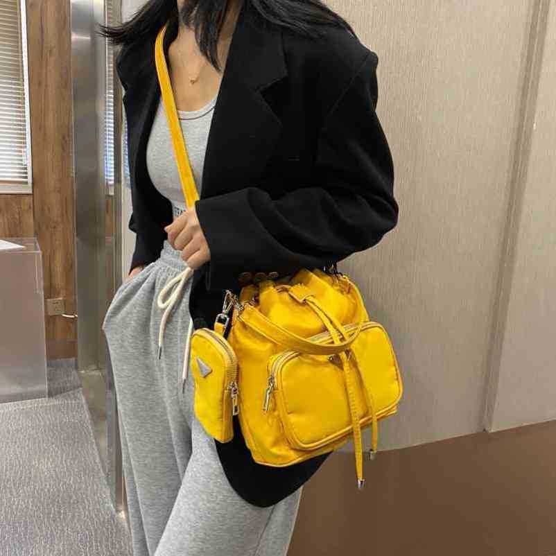 2024 New Designer womens crossbody shoulder trend and back nylon cloth backpack with bucket fashionable personality simple small bag