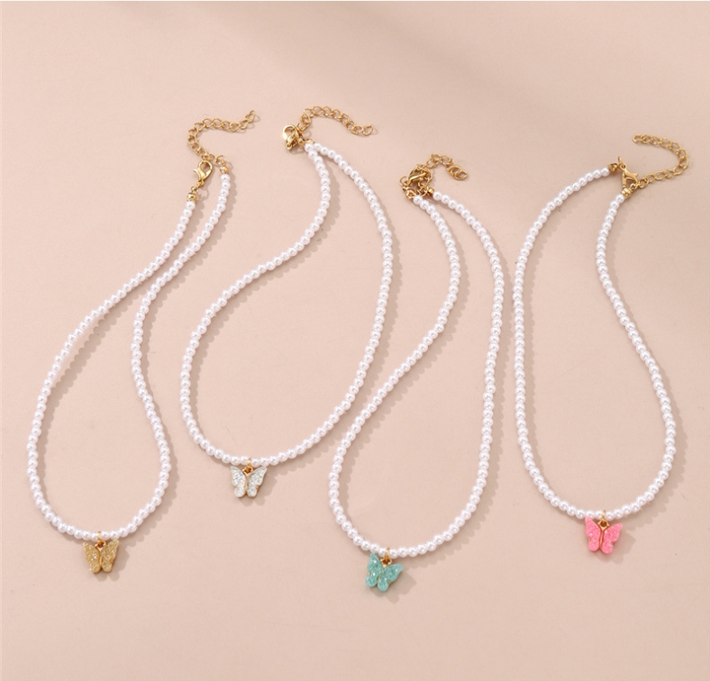 Ensemble de colliers de perles pour femmes, bijoux papillon, design de tempérament, chaîne de clavicule super sens, ensemble de quatre pièces