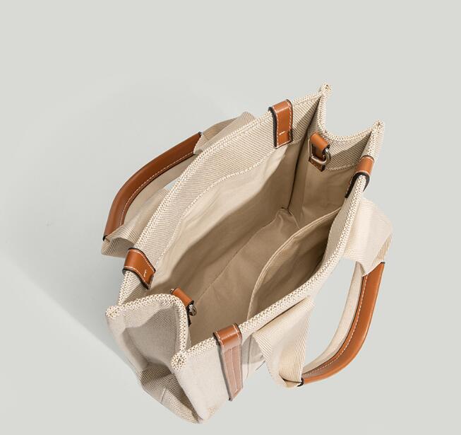2023 Kvinnor Ny bokstav Högkvalitativ väska stor kapacitet Tote Canvas Bag Versatile Handheld One Shoulder Fashion Crossbody Bag Size 26cm