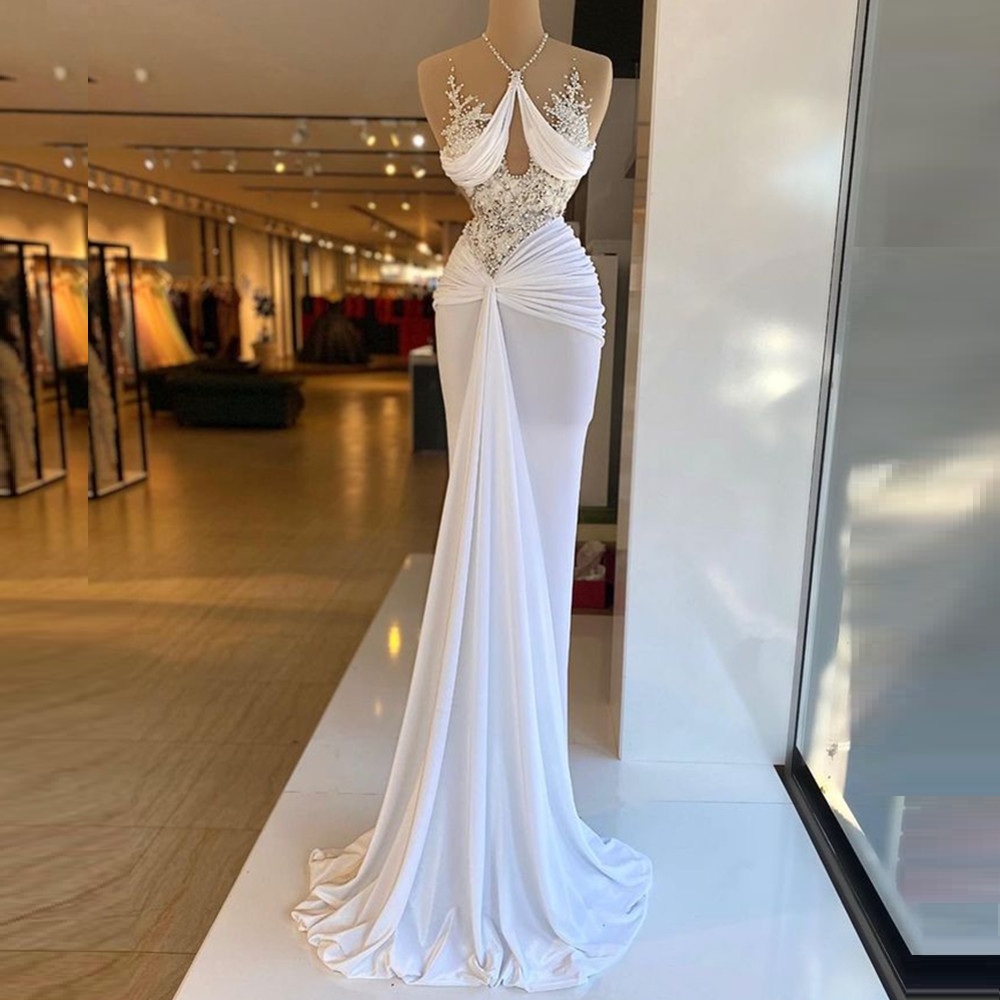 Perle Avorio Arabia Saudita Dubai Abiti da sposa Abiti da sposa moderni Abiti da sposa sexy senza maniche con perline Lunghezza del pavimento