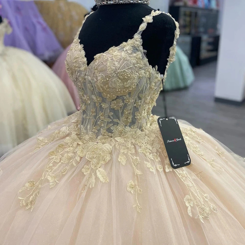 Champagne glänsande pärlkulklänning quinceanera klänningar spaghetti rem ärmlösa blommiga applikationer spetskorsett vestidos de 15 anos