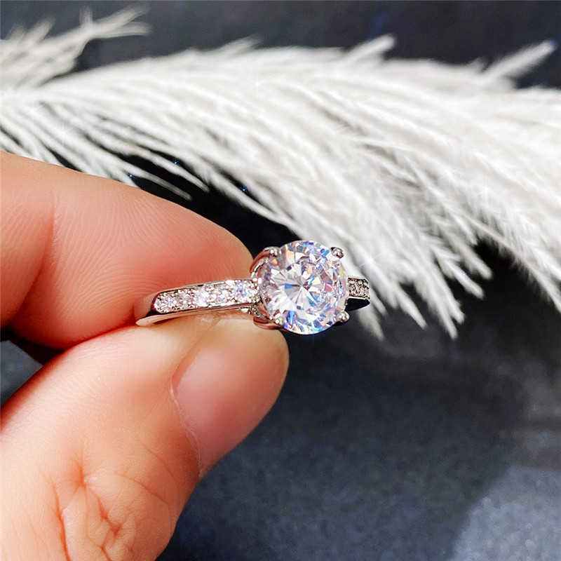 Anéis de engajamento elegantes do anel solitário para fêmea redonda de zircônia cúbica proposta de design simples proposta requintada para mulheres da moda joias y2302
