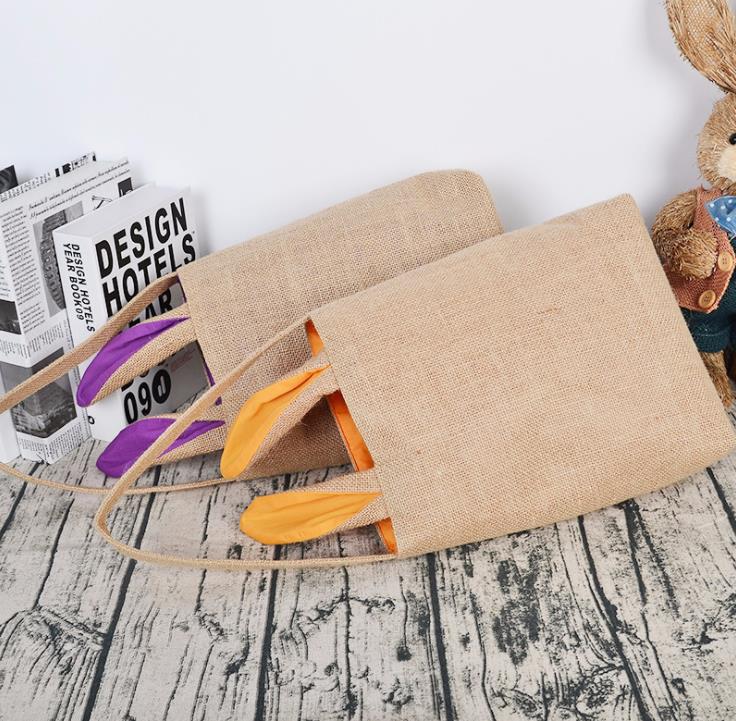 Fournitures de fête Sac de lapin de Pâques pour la chasse aux œufs Panier en toile de jute Fourre-tout Sac à main 14 couleurs Conception d'oreilles à double couche avec matériau en tissu de jute SN4788