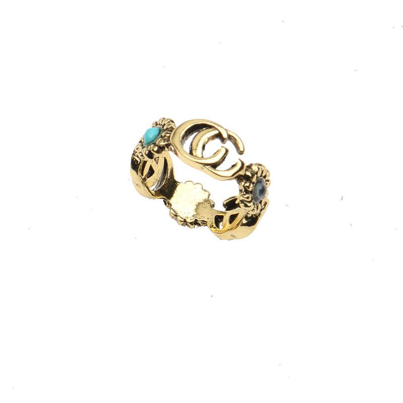 Anéis de banda de letras de marca banhados a ouro 18K de alta qualidade para homens e mulheres designer de moda letras de marca turquesa cristal metal margarida R2609