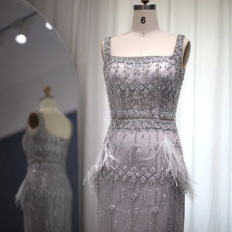 パーティードレスシャロンは、女性のための結婚式のパーティーSS279のための豪華なフェザードバイドバイドバイドバイのケープ羽毛アラビア語のイブニングドレスとキラキラしていると言った