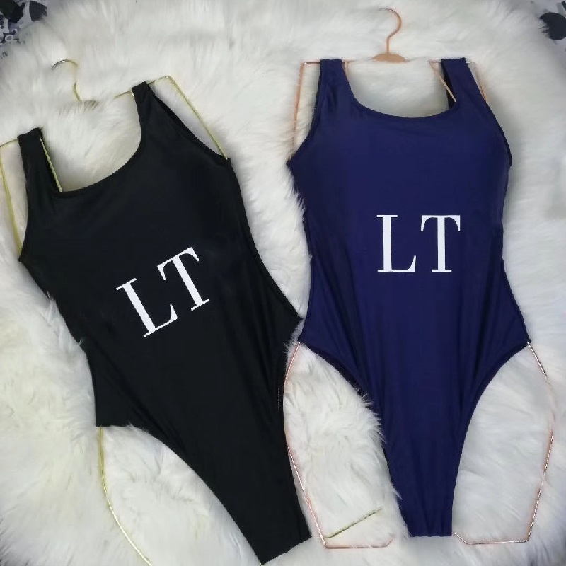 Lyxhemtextil halter simning dräkt kvinnor bikini sexig slitage kvinnlig ihålig monokini svart baddräkt vadderad simning solid bodysuit med