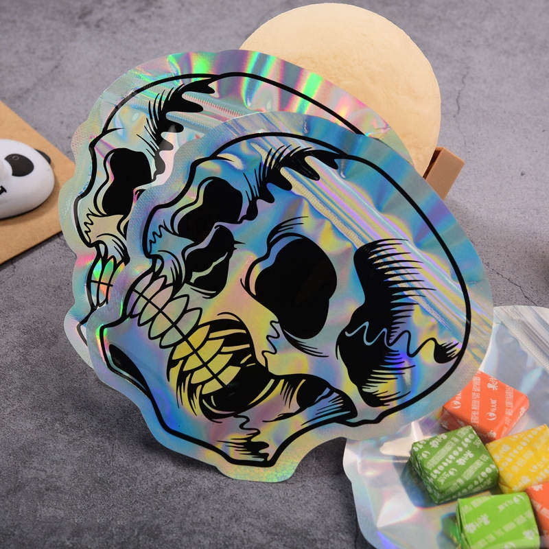 Laser Skull Sugar Mini Sacs d'emballage 12 * 12 cm Feuille d'aluminium OPP Pochette en plastique Mylar Dos transparent pour cadeau d'Halloween Herbes sèches Bonbons Biscuits Snack Stockage de paquets de noix