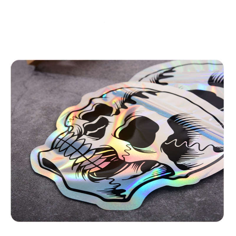 Laser Skull Sugar Mini Sacs d'emballage 12 * 12 cm Feuille d'aluminium OPP Pochette en plastique Mylar Dos transparent pour cadeau d'Halloween Herbes sèches Bonbons Biscuits Snack Stockage de paquets de noix