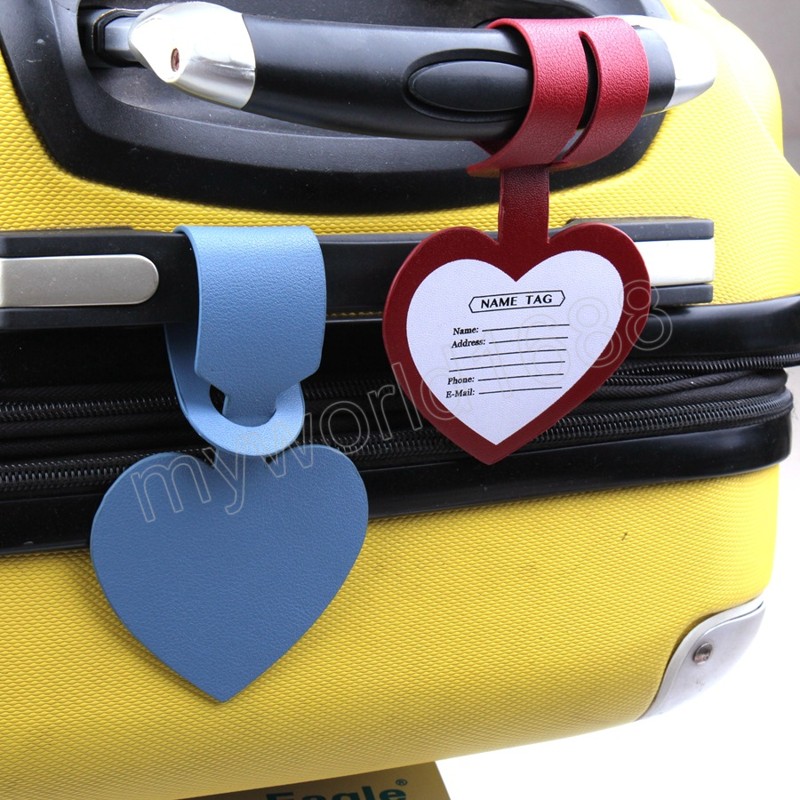 Borsa etichette bagagli a forma di cuore in pelle PU Borsa etichette bagagli con porta documenti ID valigia