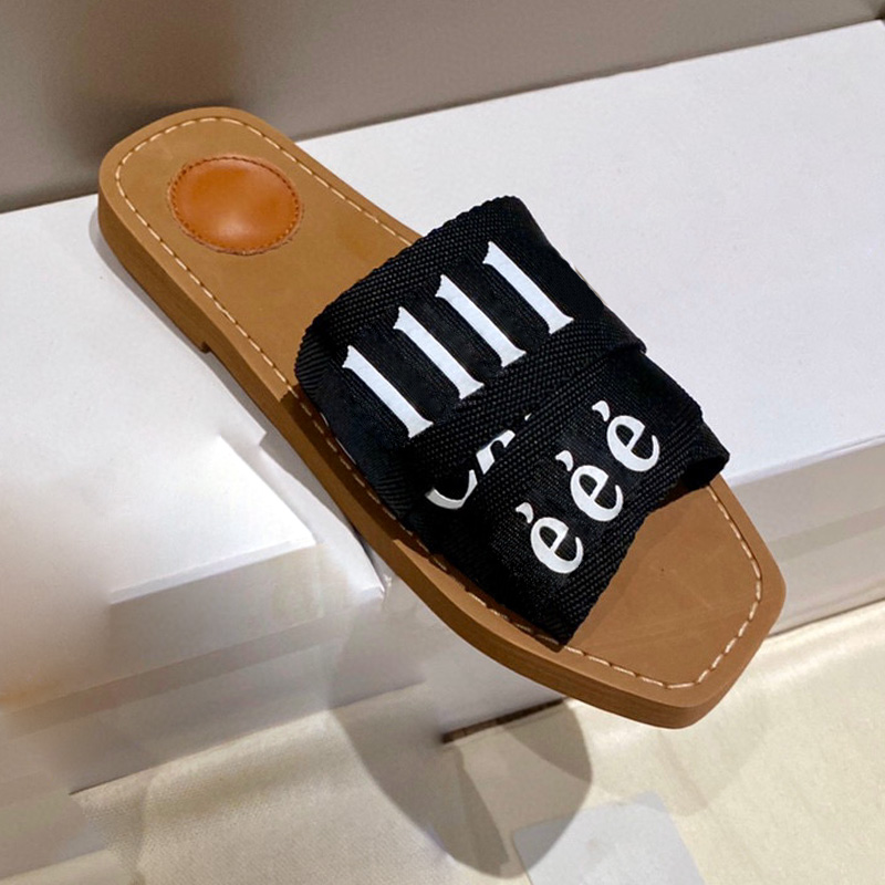 Pantofole di tela di design Donna Muli legnosi Sandali piatti Scivoli in gomma Nuovo colore Bianco Nero Tessuto con scritte in pizzo Scarpe estive da donna all'aperto