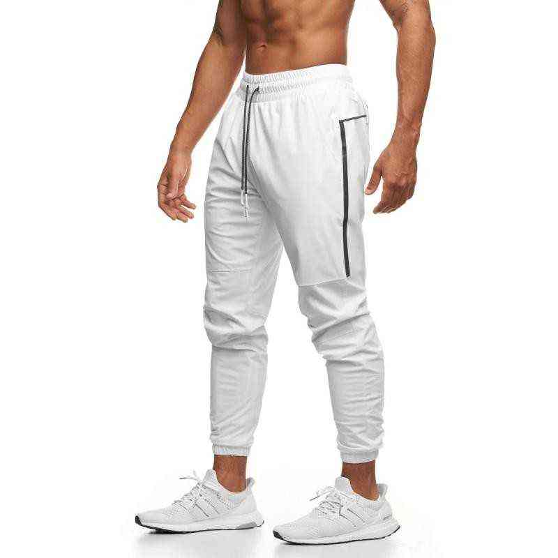 Pantalons pour hommes Hommes Jogger Pnats Pantalons de survêtement Homme Gymnases Entraînement Fitness Pantalon Mâle Casual Mode Skinny Track Pantalon Zipper Design Pantalon T220909