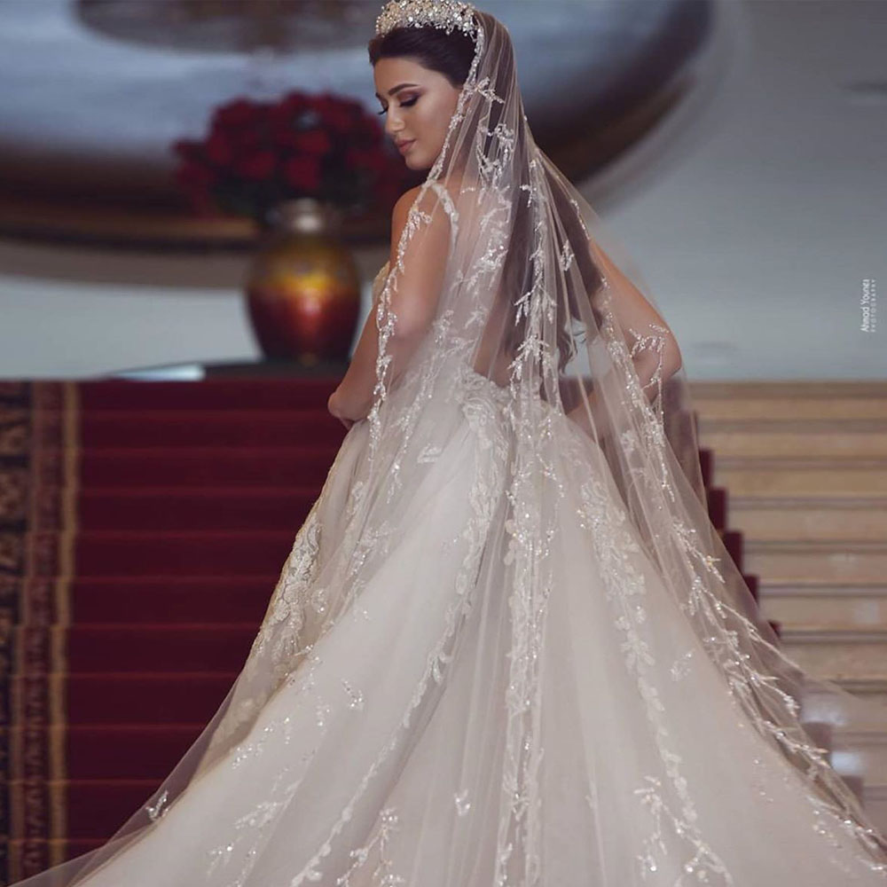 Hermosa iglesia sirena vestidos de novia cuello en V apliques de encaje árabe Dubai vestido de novia sin espalda sobrefalda robe de mariee