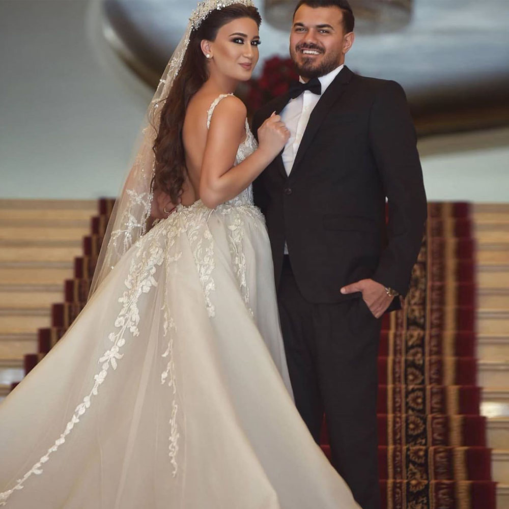 Hermosa iglesia sirena vestidos de novia cuello en V apliques de encaje árabe Dubai vestido de novia sin espalda sobrefalda robe de mariee