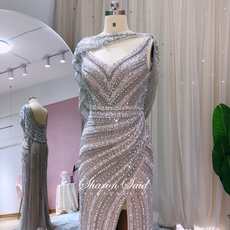 Abiti da festa Luxury Silver Mermaid Dubai Abito da sera con mantello Abiti da cerimonia con spacco laterale con perline pesanti le donne Abito formale da cerimonia nuziale 220923