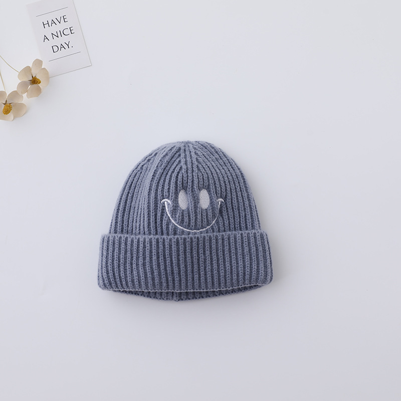 M514 Autumn Winter Baby barn stickad hatt för pojkar pojkar tecknad broderi leende kepsar barn skalle mössor varma hattar