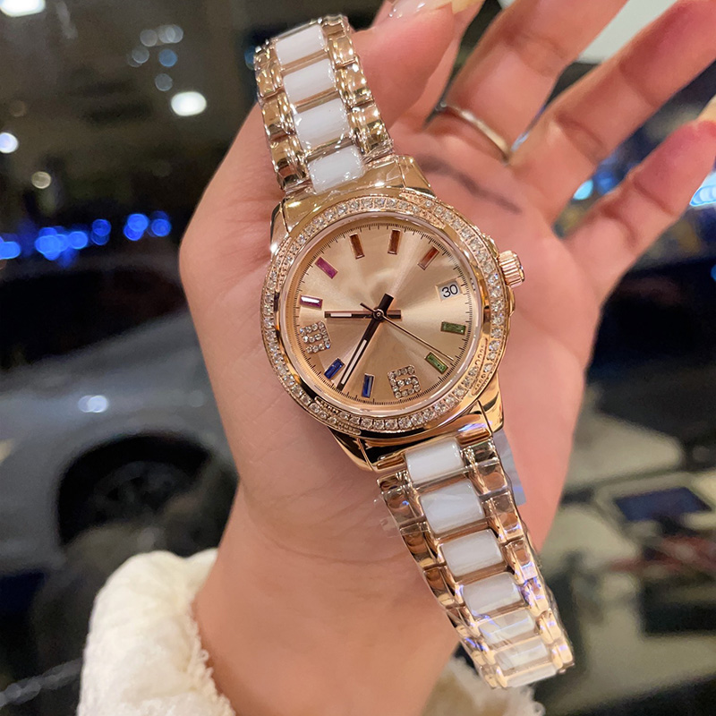 女性の時計クォーツムーブメントウォッチファッション腕時計ステンレススチールレザーストラップモントレデュラックスビジネスデザインダイヤモンドベゼル35mm