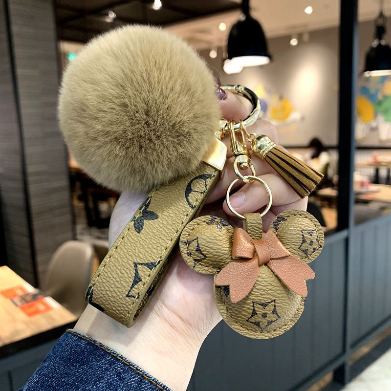 Designer nyckelring björnhuvud läder pälsboll pendel nyckel kedja båge bil hänge metall mode personlighet kreativ söt söt