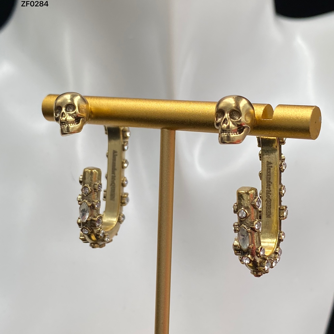 Новые разработанные женщины болтаются серьги из черепа рубиновая асимметрия латунь 18k золотые дамы.