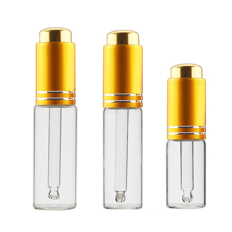 5ml 10ml 15ml 20mlプレスピペットボトルゴールドシルバーリッド空の透明ガラスエッセンシャルオイルドロッパーバイアル化粧品補充可能な容器