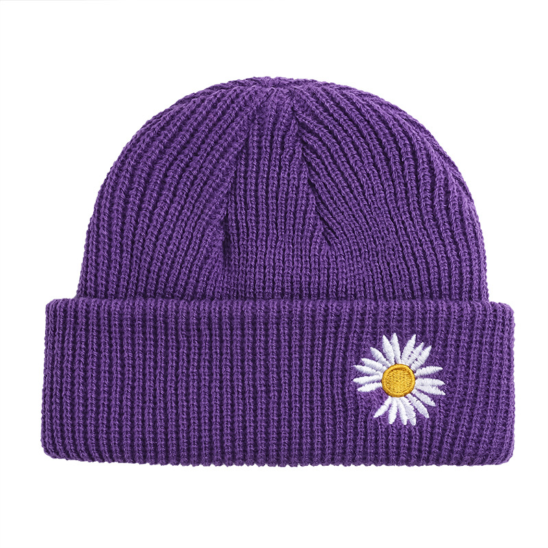 Petit chapeau de laine de marguerite nouveau coréen tricot tricot women a automne hiver homme extérieur chat de froide en gros