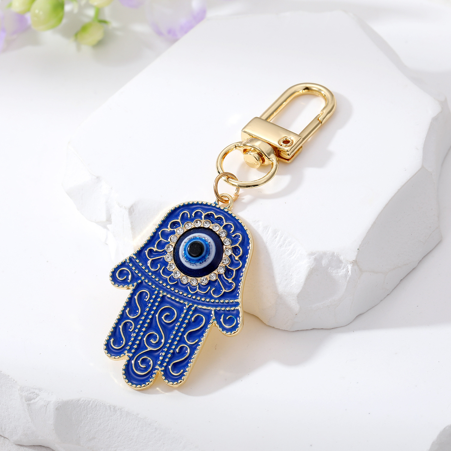 Bling Hollow Evil Eye Hamsa Hand Nyckelring Nyckelring för kvinnor Män Zircon Fatima Hand Blue Eye Bag Car Airpods Box Nyckel Tillbehör