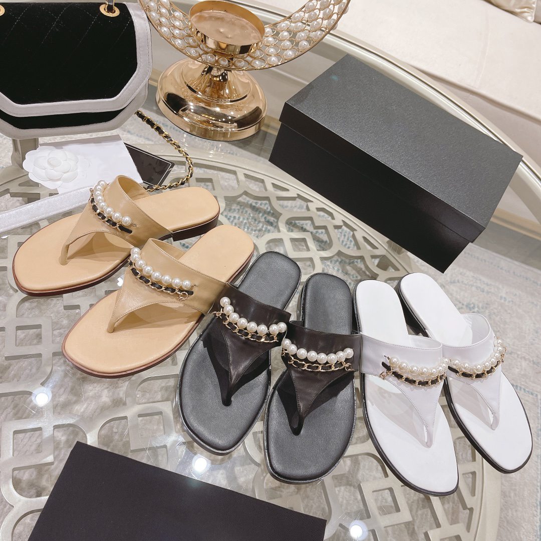 Designer kvinnor tofflor flip flop sandaler inomhus platt vintage grosgrain imitation p￤rlor ￶ppen t￥ sn￶rning klackar sandal sommar lyxiga mode damer strand tofflare