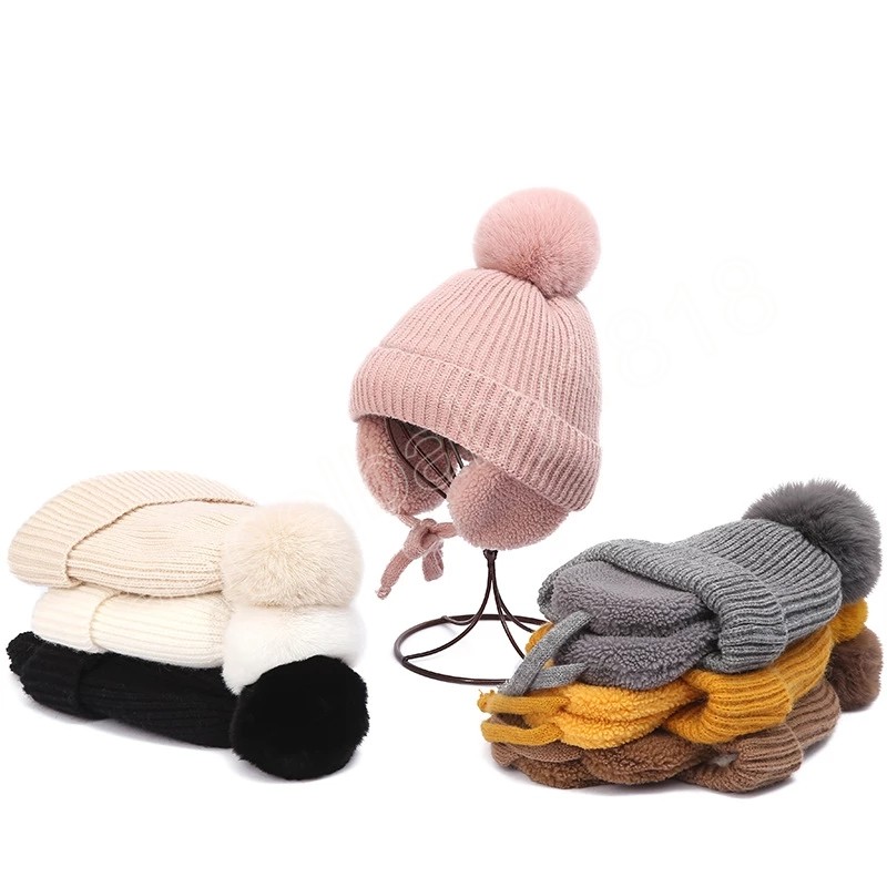 Caldo cappello invernale bambini Berretto con paraorecchie bambini lavorato a maglia spessa con pompon carino Berretti con protezione le orecchie bambini in tinta unita