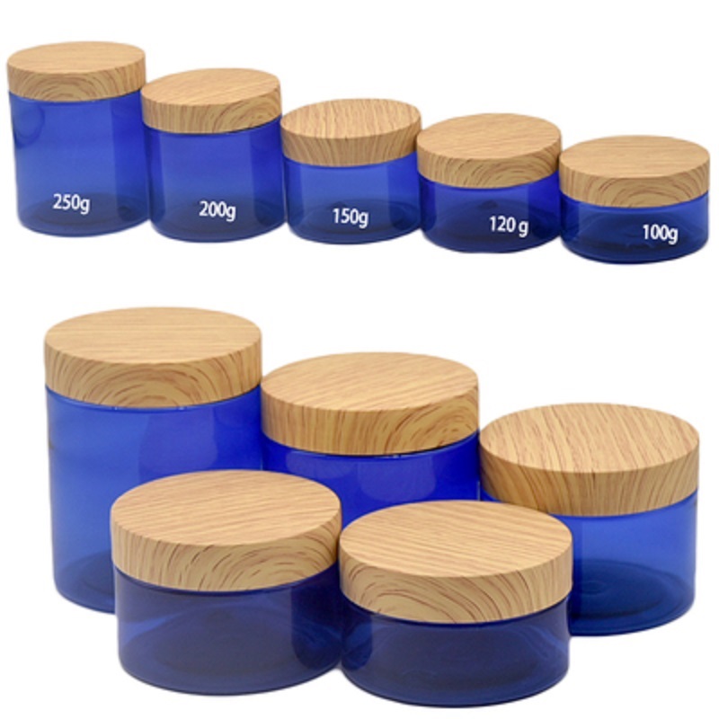 Verpackung: Leere Plastikflasche, klares und mattiertes blaues Glas, falsche Holz-Kunststoffabdeckung, nachfüllbar, kosmetischer tragbarer Verpackungsbehälter, 100 g, 120 g, 150 g, 200 g, 250 g