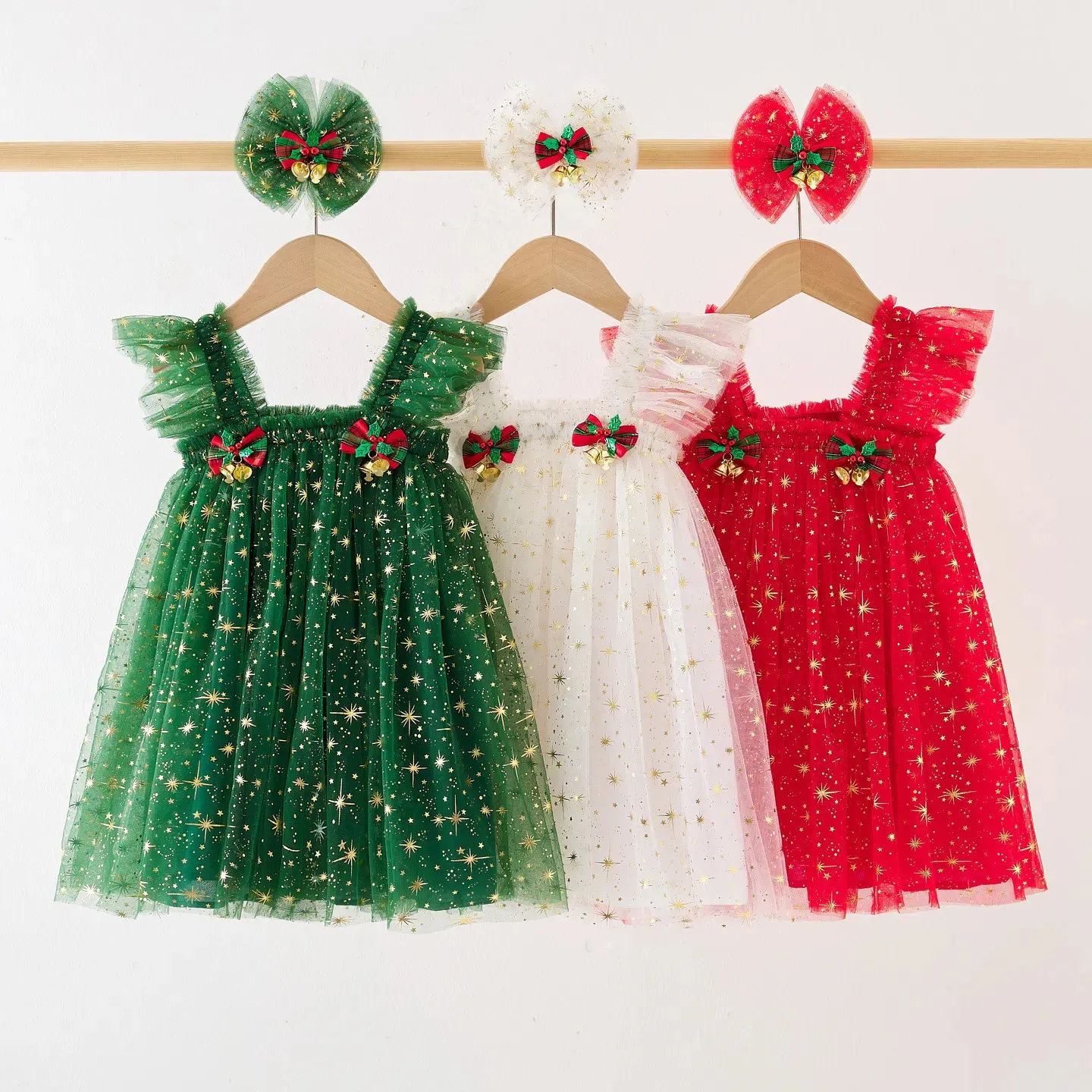 christmas tree cake dress Beautiful Woman Standing in a Green Dress Near a Christmas Tree and Holding a Cake in Her Hands Stock Photo
