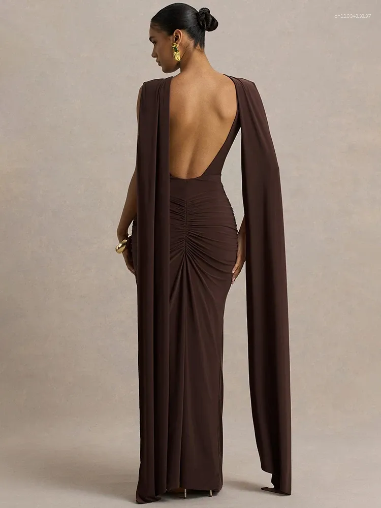 backless cape dress Elvara Model is wearing Nude color Cutout Cape Sleeve Gown With