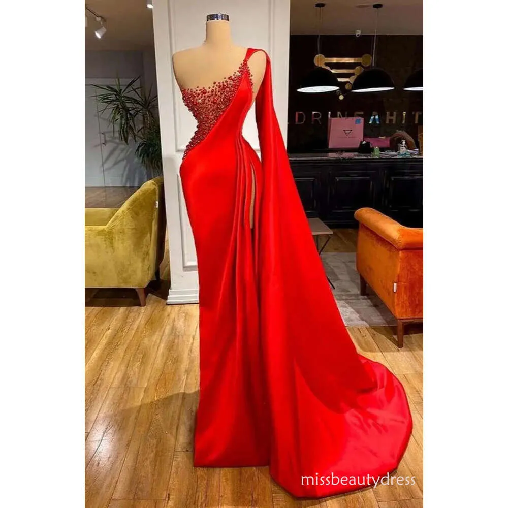 red one shoulder prom dress One-Shoulder Formal with Gloves A fitted long dress skirt with high slit and ruching is so flattering and detailed with a high slit and slight train Sparkly Red Sequin One Shoulder