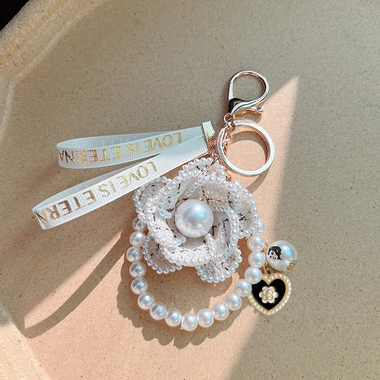 Free Shipping 2026 Korean Style Pearl Camellia Flower Keychain Creative Design Bag Charm Pendant Elegant Car Key Ring_voghion.com