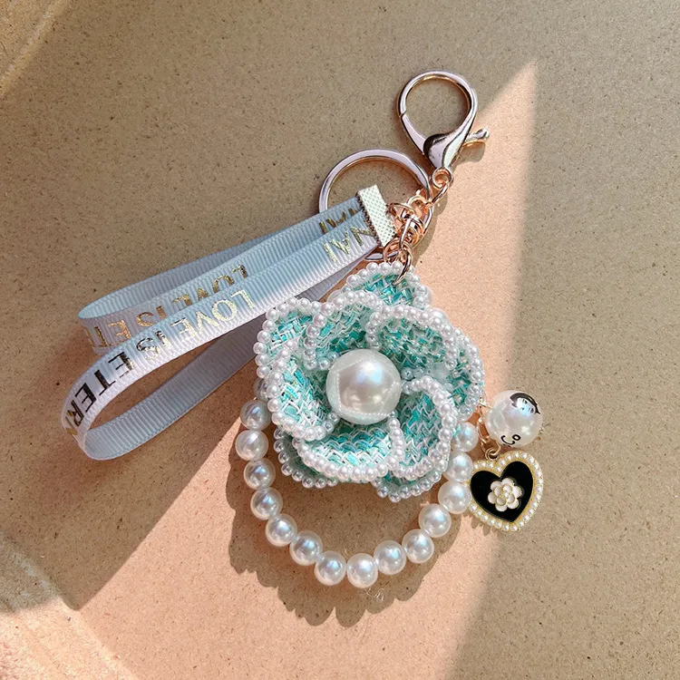 Free Shipping 2026 Korean Style Pearl Camellia Flower Keychain Creative Design Bag Charm Pendant Elegant Car Key Ring_voghion.com