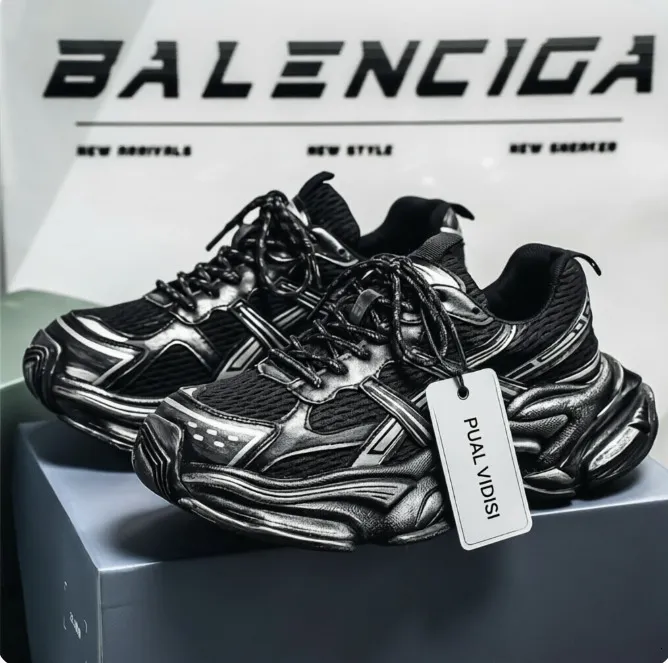 Sneakers da uomo nere e argento, robuste e massicce, modello "dad sneakers" con finitura effetto invecchiato._voghion.com