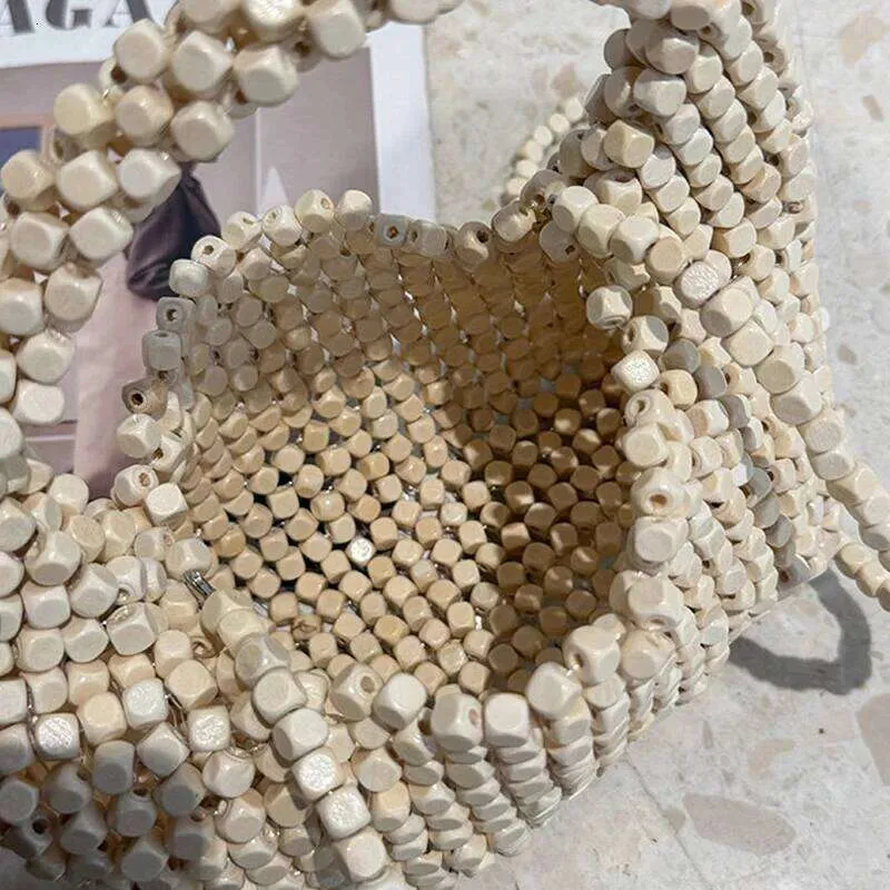 Kleine Strandtaschen für Damen, luxuriöse Designer-Handtaschen, neu, handgewebt, mit hohlen Holzperlen verziert_voghion.com