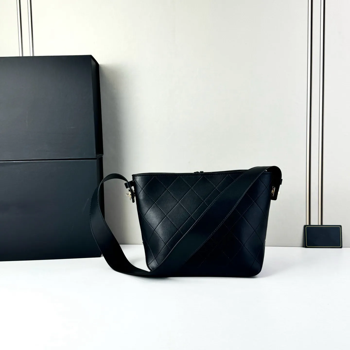 black quilted faux leather bucket backpack Restyle Clothing - Sanctum and an adjustable toggle fastening Designer Quilted Black Drawstring Bucket