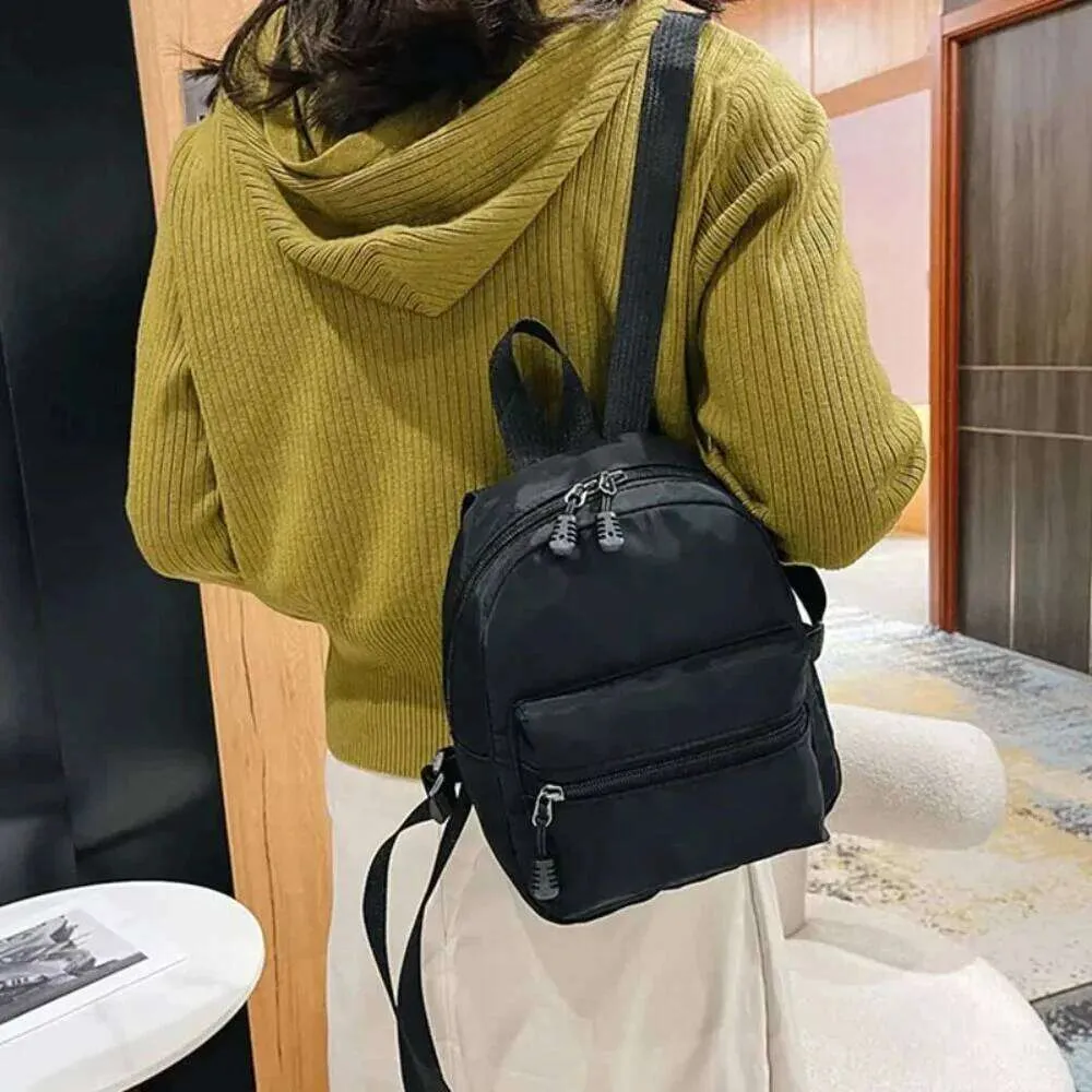 fashionable mini backpacks nylon Tess Backpack Pink 10 H x 6.5 W x 4 L Front pocket measures Nylon Mini Backpack Hot Pink