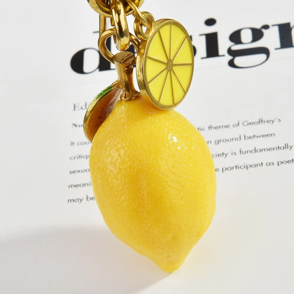 Hot Selling Charm New Creative Resin Simulation Fruit Lemon Car Bag Pendant Couple Keychain Gift Free Shipping_voghion.com