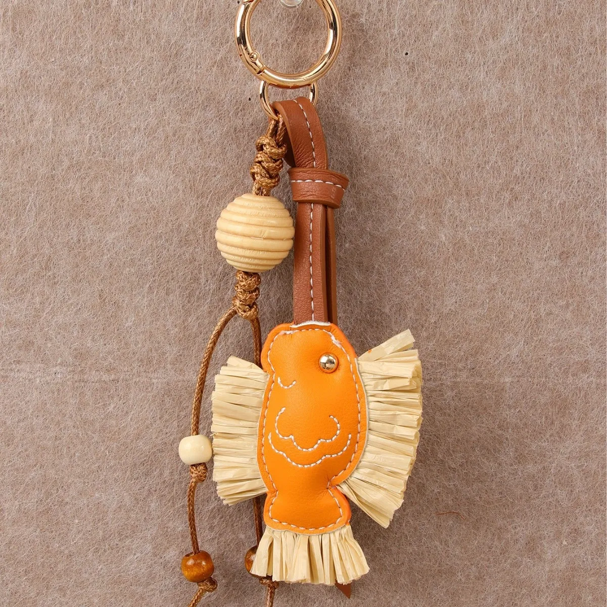 hot Selling Designer Charm New Year Series Annual PU Patchwork Rafia Fish Wooden Bead Weaving Rope Creative Bag Pendant_voghion.com