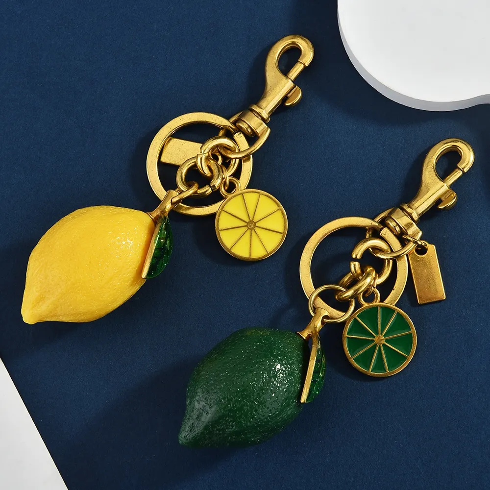 Hot Selling Charm New Creative Resin Simulation Fruit Lemon Car Bag Pendant Couple Keychain Gift Free Shipping_voghion.com