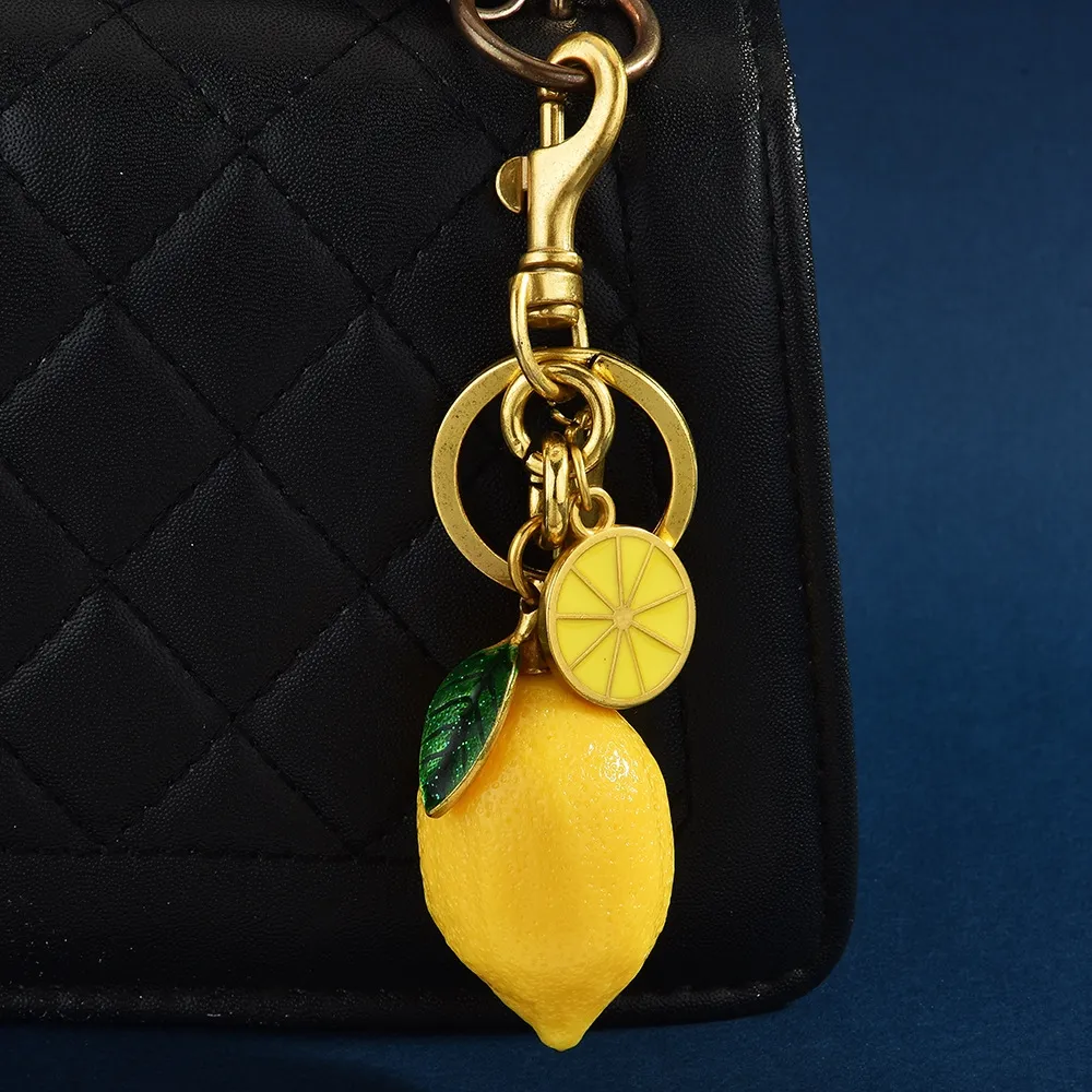 Hot Selling Charm New Creative Resin Simulation Fruit Lemon Car Bag Pendant Couple Keychain Gift Free Shipping_voghion.com