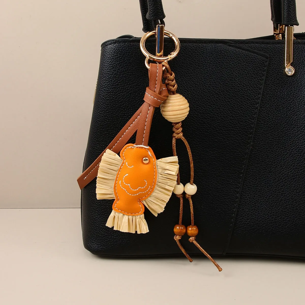 hot Selling Designer Charm New Year Series Annual PU Patchwork Rafia Fish Wooden Bead Weaving Rope Creative Bag Pendant_voghion.com