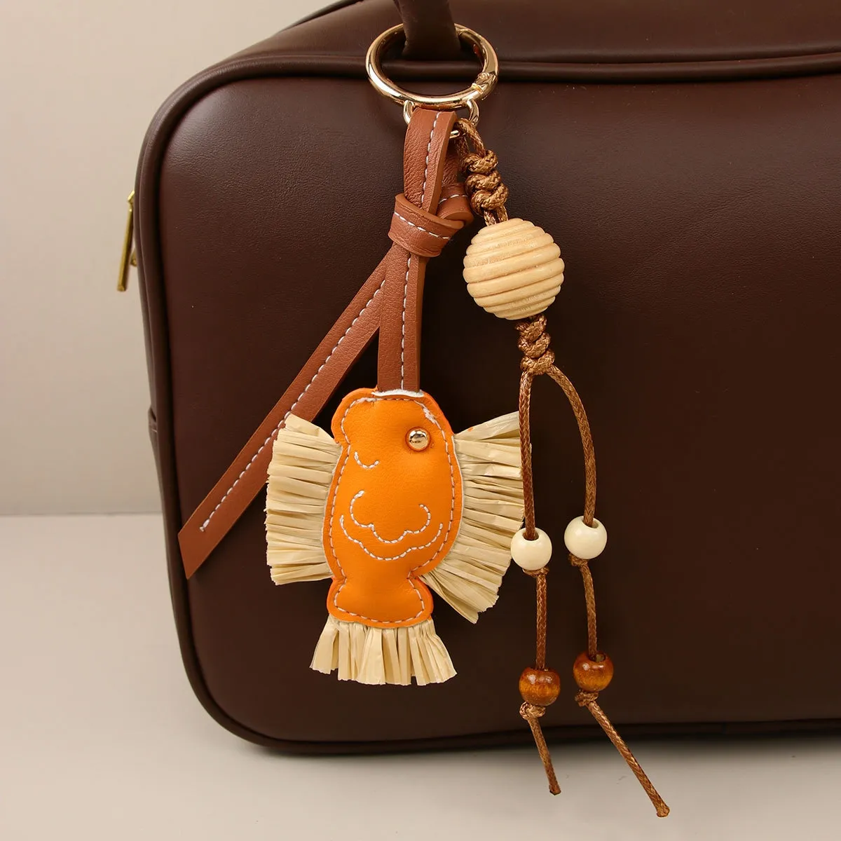 hot Selling Designer Charm New Year Series Annual PU Patchwork Rafia Fish Wooden Bead Weaving Rope Creative Bag Pendant_voghion.com