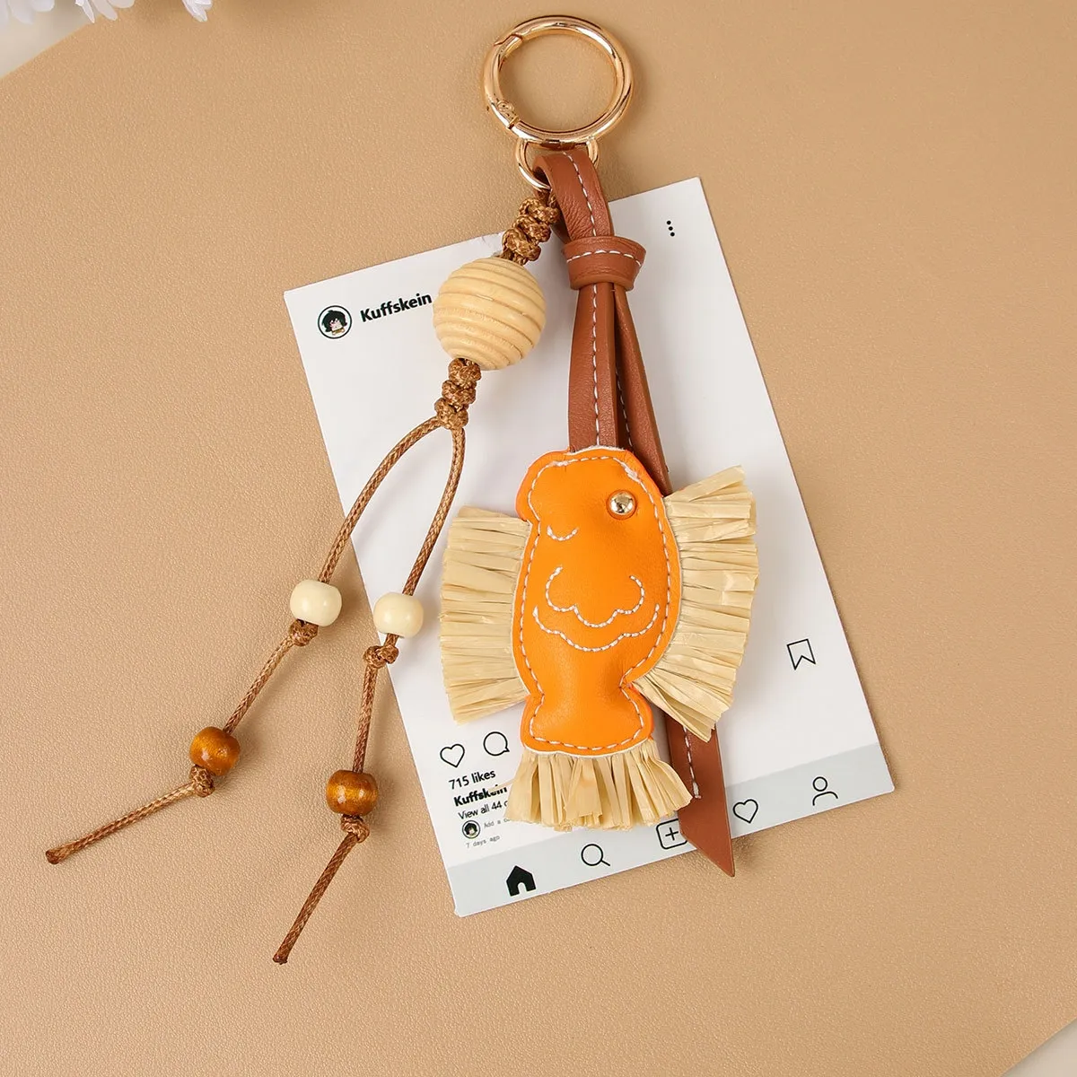 hot Selling Designer Charm New Year Series Annual PU Patchwork Rafia Fish Wooden Bead Weaving Rope Creative Bag Pendant_voghion.com